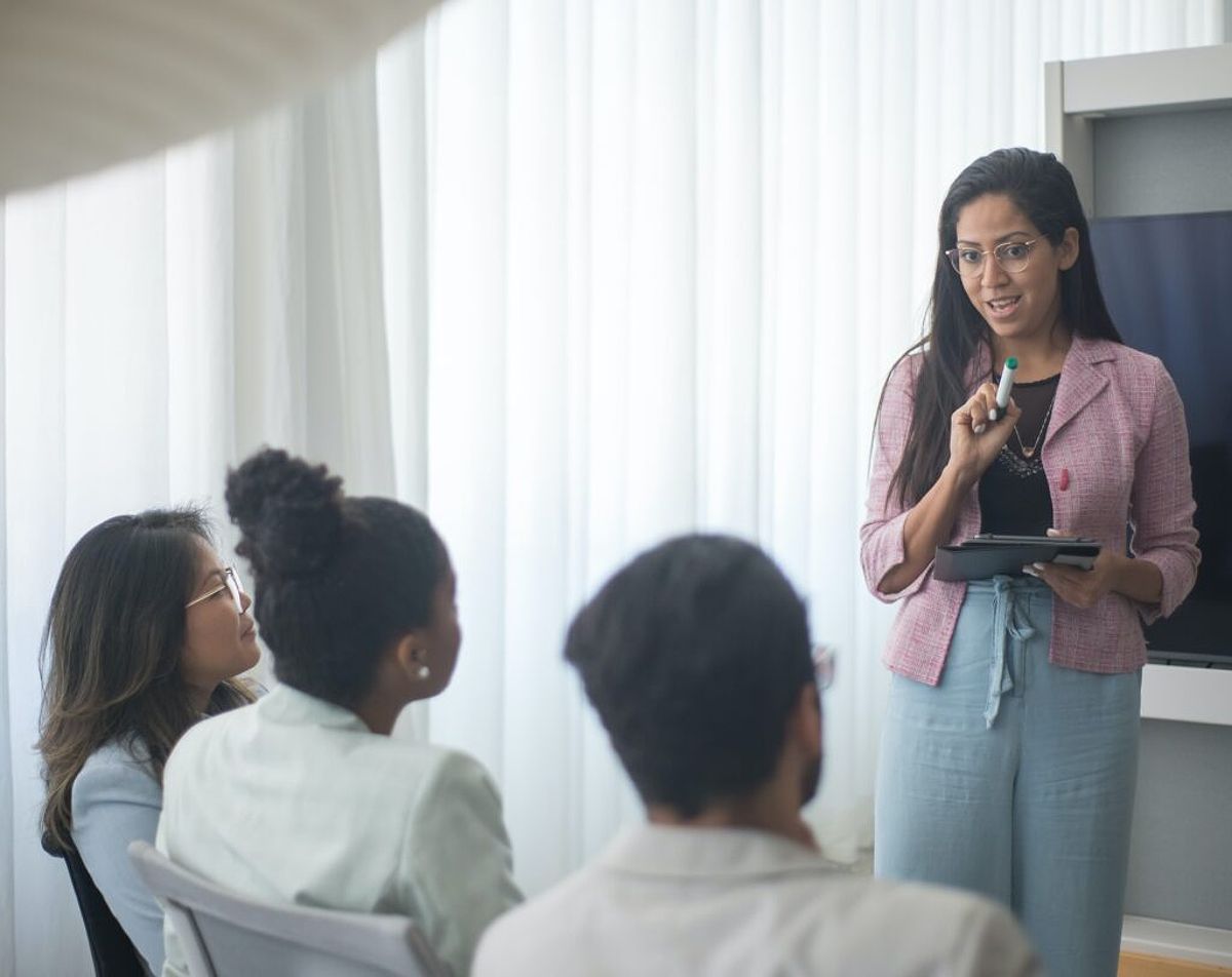 Employees attend a meeting to help reduce retail shrink